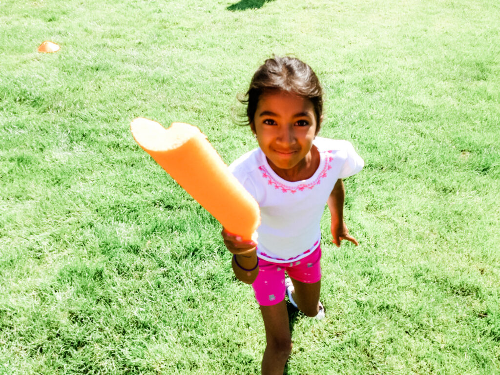 Girl Holding Pool Noodle