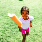 Girl Holding Pool Noodle
